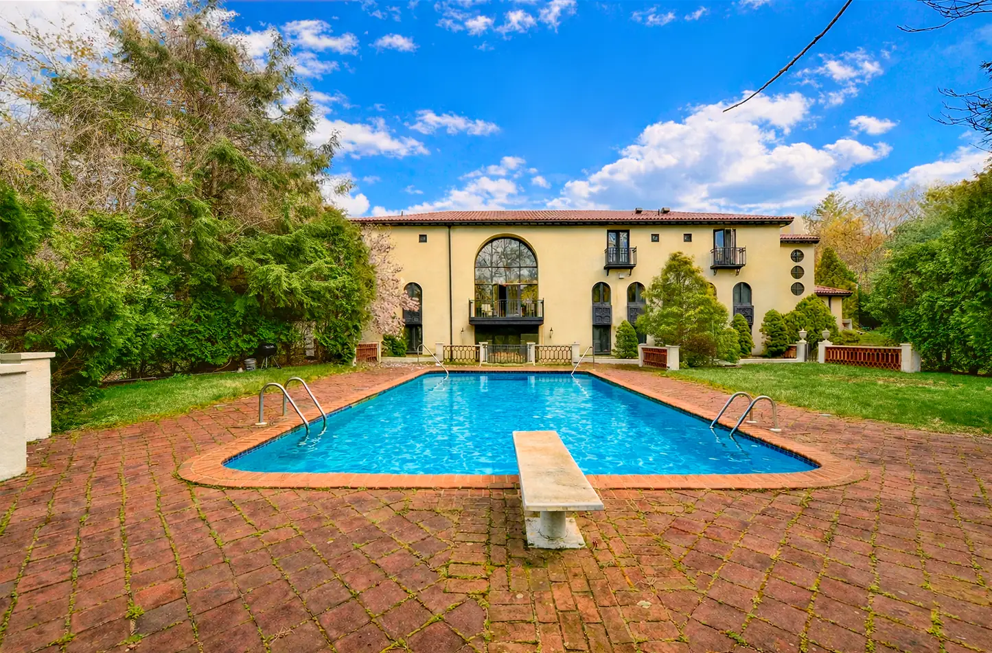 Pool courtyard, sky replaced and pool water turned blue, after editing